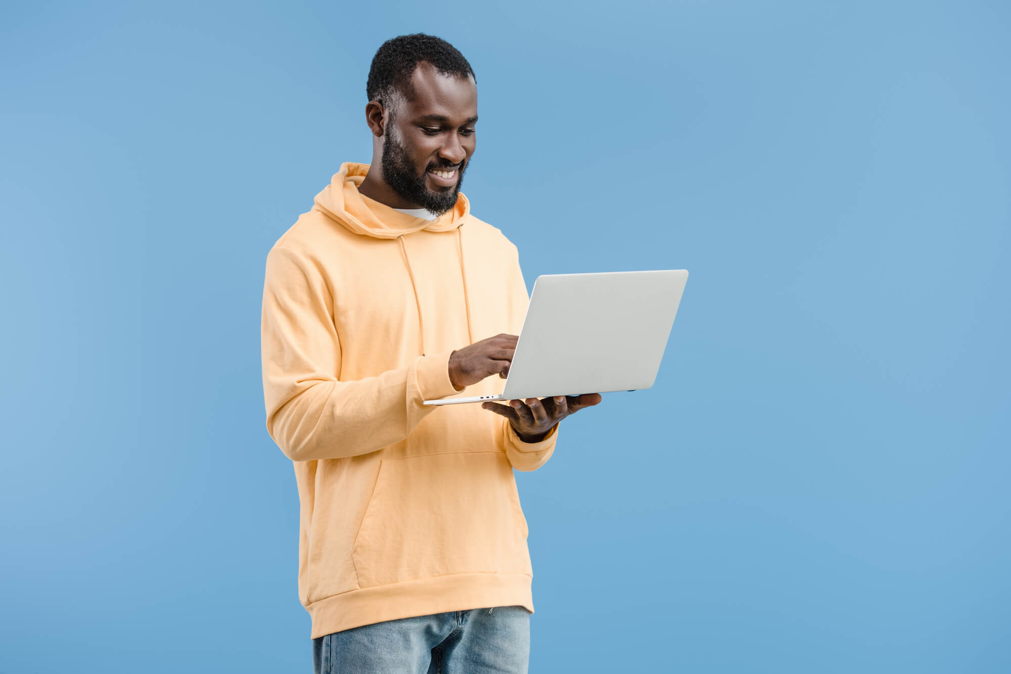smiling young african american man using laptop is 2022 12 07 01 14 00 utc.jpg